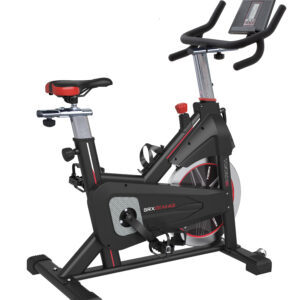 Indoor stationary bike with a digital console, curved padded handlebars, and a black/red frame.