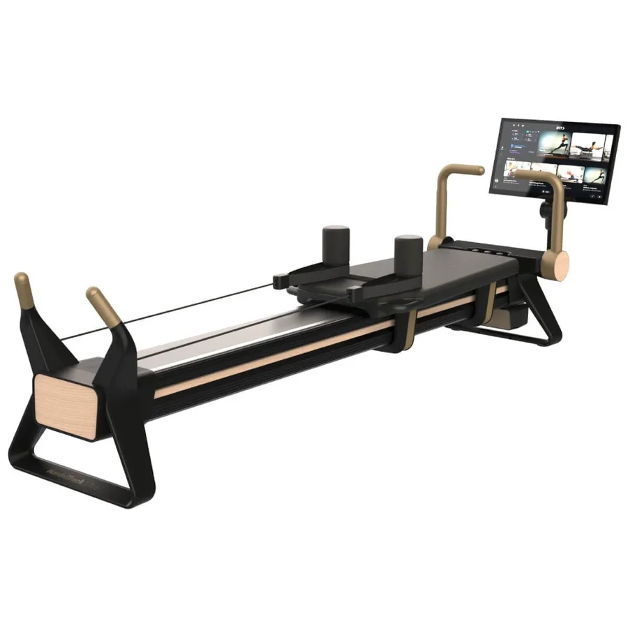 Modern rowing machine with a large mounted touchscreen monitor for guided workouts at the rear, black frame and wooden accents in front area.